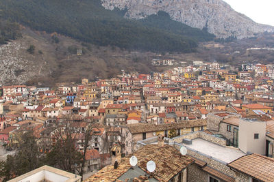 High angle view of townscape against mountains