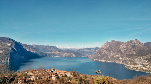 Panoramic view of lake against blue sky