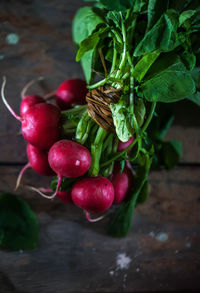 There is a bunch of delicious fresh radishes on the table