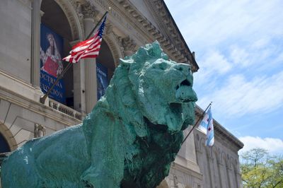 Low angle view of statue against built structure