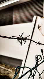 Close-up of barbed wire fence