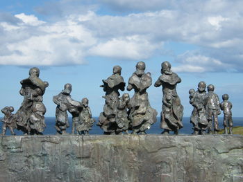 Low angle view of statues against the sky