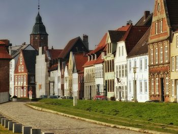 Buildings in city against sky