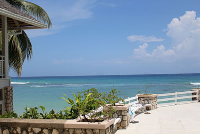 View of beach against cloudy sky