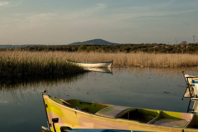 Scenic view of boats in lake