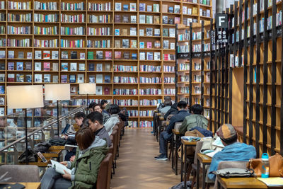 Group of people in front of books