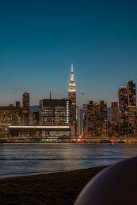 Illuminated city at waterfront