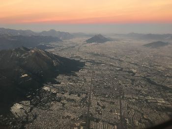 High angle view of city during sunset