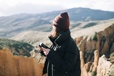 Man photographing camera on mountain