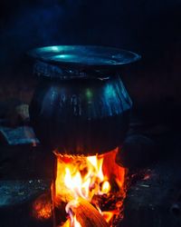 Container heating on camping stove at night