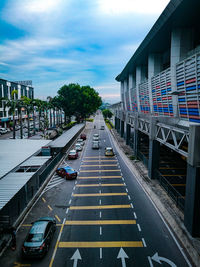 High angle view of street by buildings in city