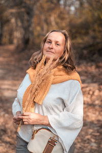 Portrait of woman standing outdoors