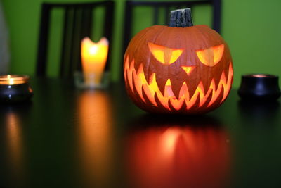 Close-up of illuminated pumpkin against blurred background