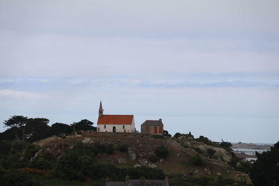 Houses and buildings against sky