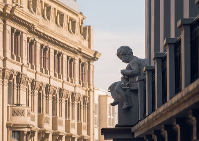 Low angle view of statue in city