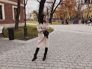 Rear view of woman walking on street