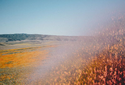 Scenic view of land against clear sky