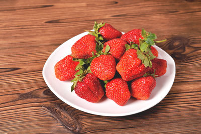 High angle view of strawberries in bowl on table