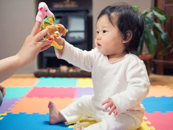 Close-up of boy playing with finger puppets