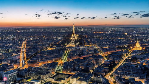 Aerial view of city buildings during sunset