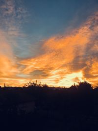 Scenic view of silhouette landscape against sky during sunset