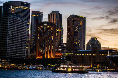 Illuminated city at waterfront