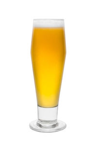 Close-up of beer glass against white background