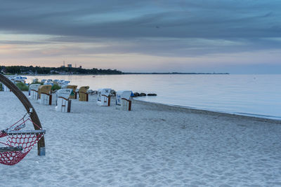 Scenic view of beach against sky during sunset