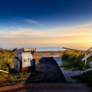 Scenic view of beach against sky during sunset