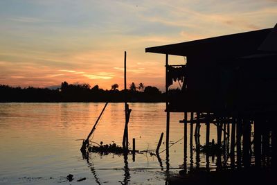 Scenic view of lake at sunset