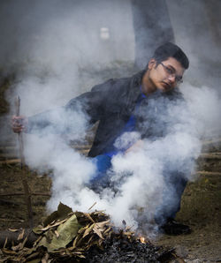 Portrait of man holding stick