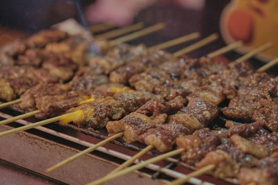 High angle view of meat on barbecue