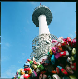 Low angle view of ferris wheel against sky