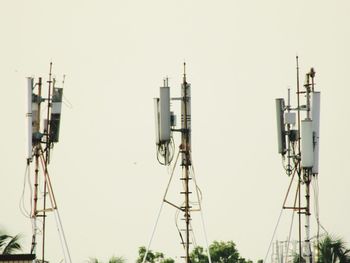 Low angle view of communications tower against clear sky