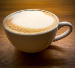 Close-up of cappuccino on table