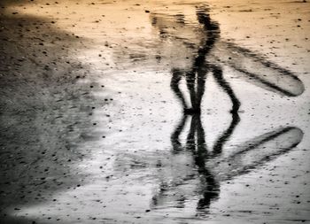 High angle view of shadow on sand