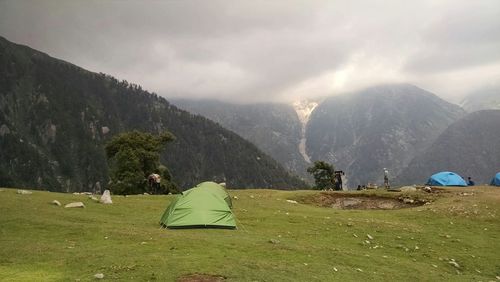 Scenic view of landscape against cloudy sky