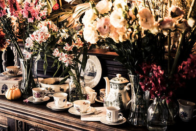 Various flowers in vase on table