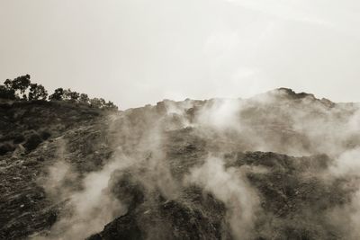 Scenic view of waterfall against clear sky