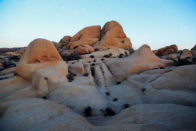 Scenic view of mountains against blue sky