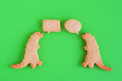 Close-up of cookies against green background