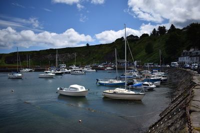 Boats moored at harbor