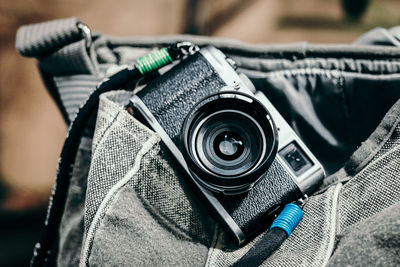 Close-up of camera on bag