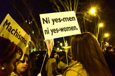 Protestors with banners at night