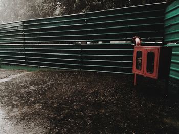 Red telephone booth on wall