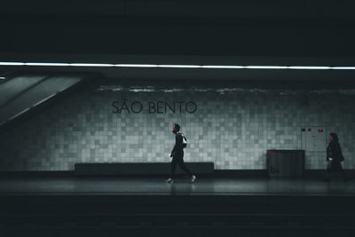 Full length of man standing at subway station