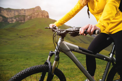 Woman riding bicycle on road