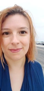 Close-up portrait of a smiling young woman
