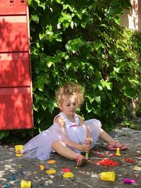 Cute girl playing plants