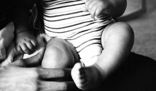 Low section of mother with baby